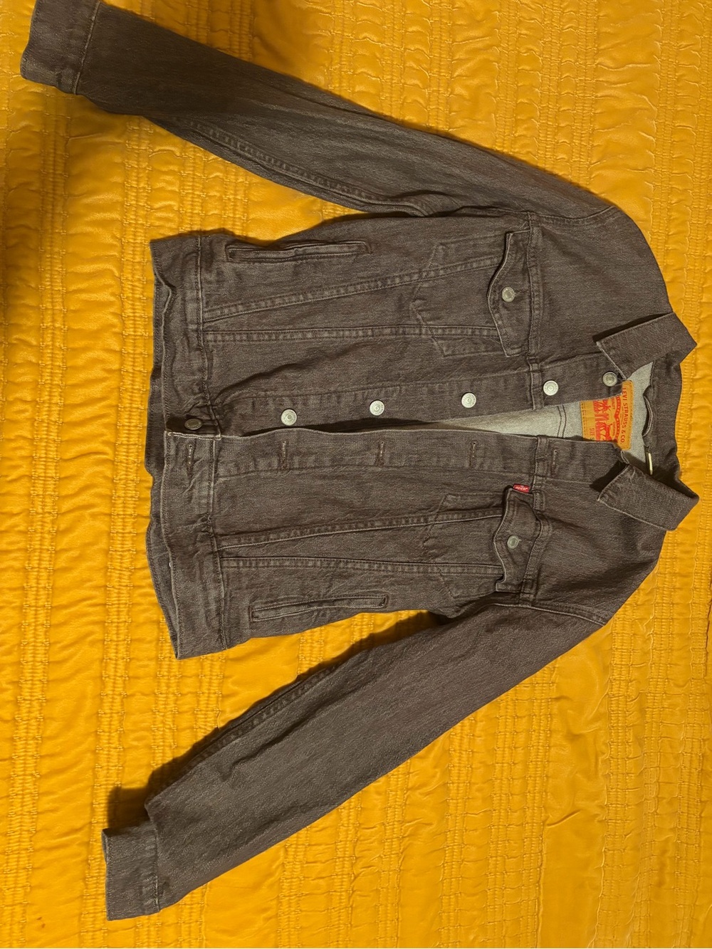 Levi's gray denim jacket with tan leather patch